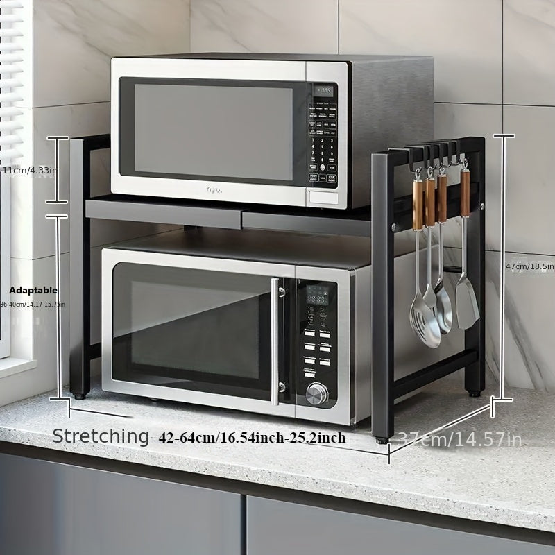 Kengaytiriladigan 2-qavatli metall stol usti pech qismi, qora karbon po'latdan tayyorlangan va oson harakat uchun g'ildiraklar bilan. Mikrotolqinli pech, idish-tovoq va oshxona muhim buyumlarini tartibga solish uchun ideal.