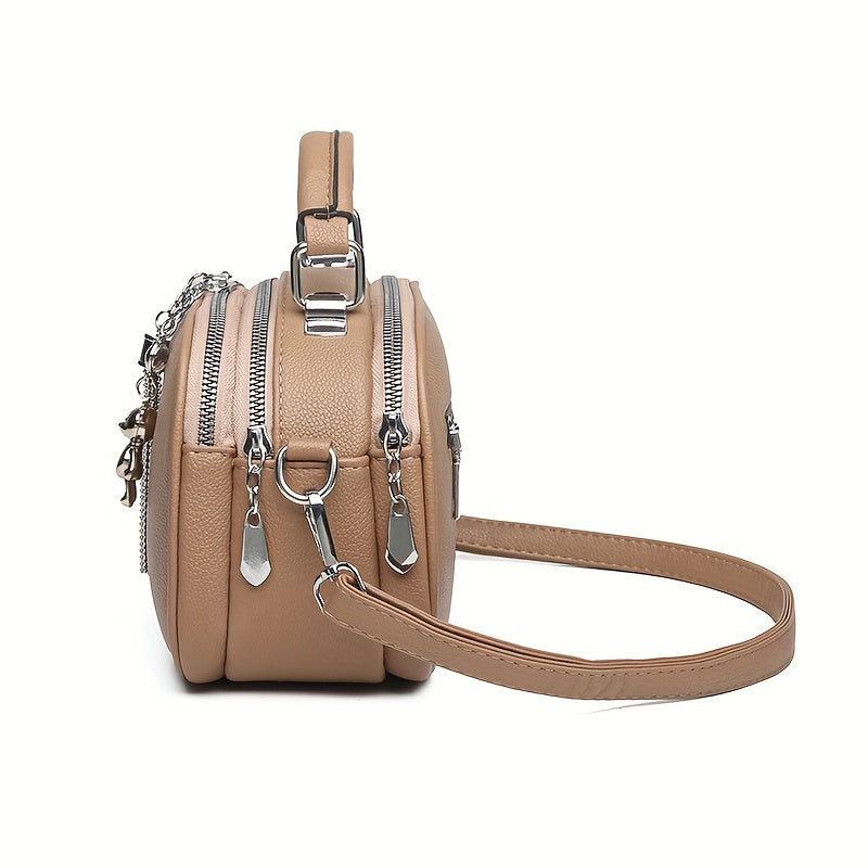 Black Mini Crossbody Bag with Bear Tassel and Multiple Compartments