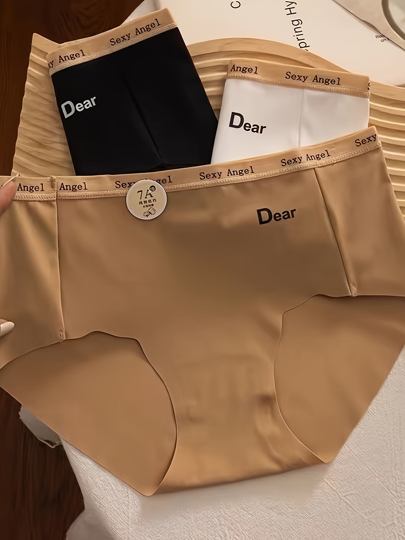 Три комплекта вязаных женских трусиков-треугольников средней посадки.