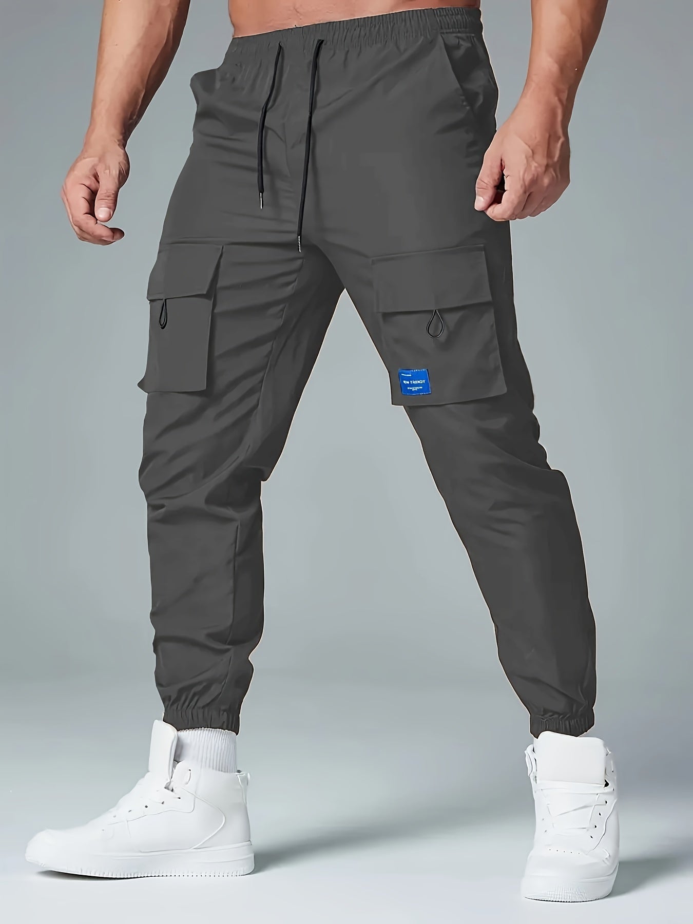 Men's Polyester Cargo Pants with Drawstring Waist and Multiple Pockets for Spring and Fall