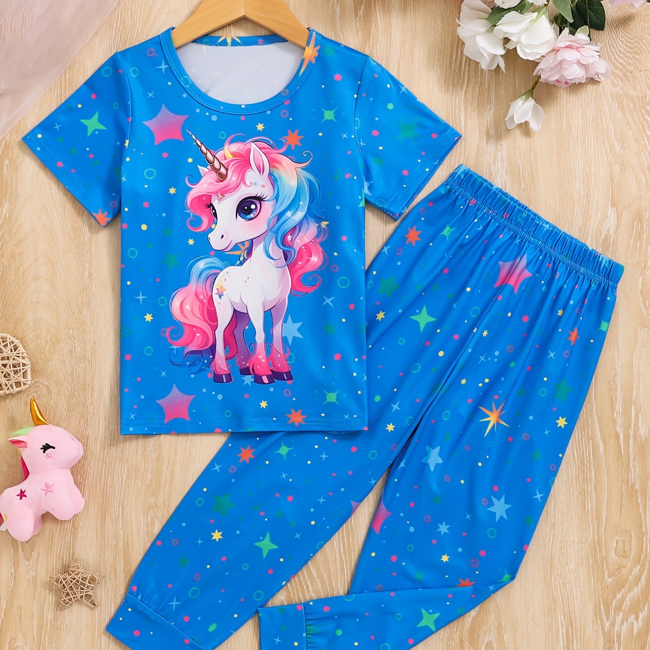 Qizlar uchun pushti unicorn va yulduz naqshli pijama to'plami, olovga chidamli, qulay qisqa yengli ko'ylak va uzun shimlar, bahor/kovak sovg'asi uchun ideal, mashinada yuvish mumkin.