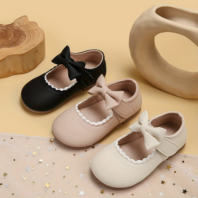 Qizlar uchun bowknot detali bilan zamonaviy Mary Jane tekis poyabzal, barcha mavsumlar uchun ideal.