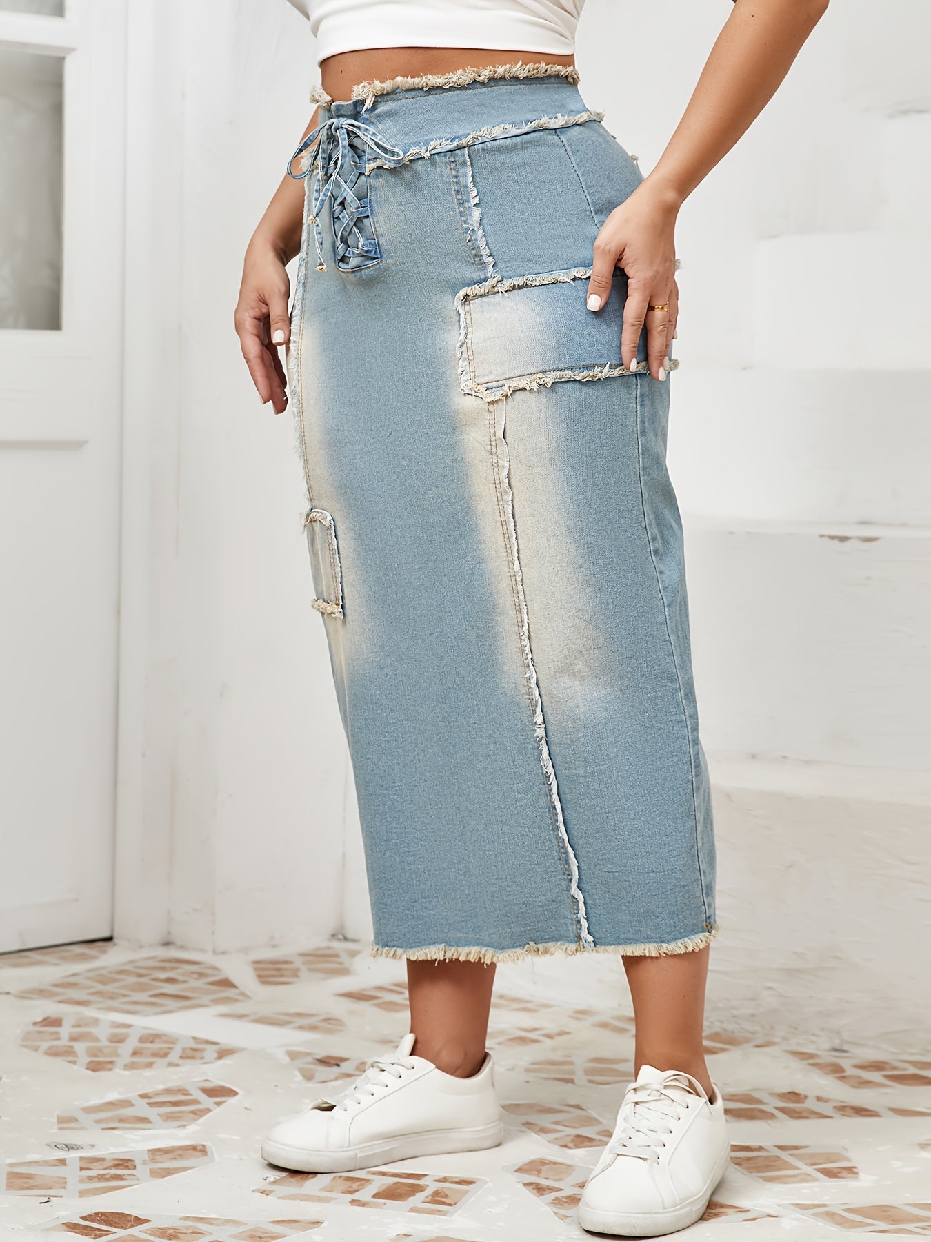 Women's High-Waist Denim Midi Skirt with Frayed Hem and Lace-Up Details in Light to Dark Blue Wash