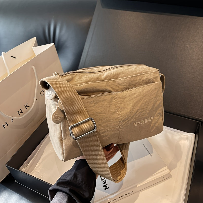 Стильная нейлоновая сумка через плечо для женщин: просторная, легкая, универсального однотонного цвета с застежкой на молнии, идеальна для повседневного использования. Доступна в цветах хаки/черный.