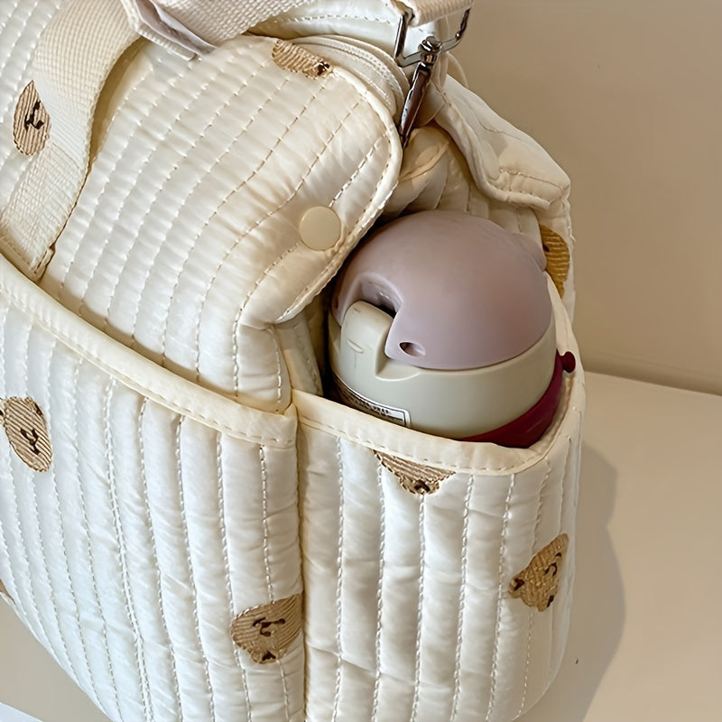 Sayohat va pampers saqlash uchun mo'ljallangan, zamonaviy printga ega katta sig'imli ota-onalar sumkasi, qo'shimcha qulaylik uchun trolley ulanishi bilan.