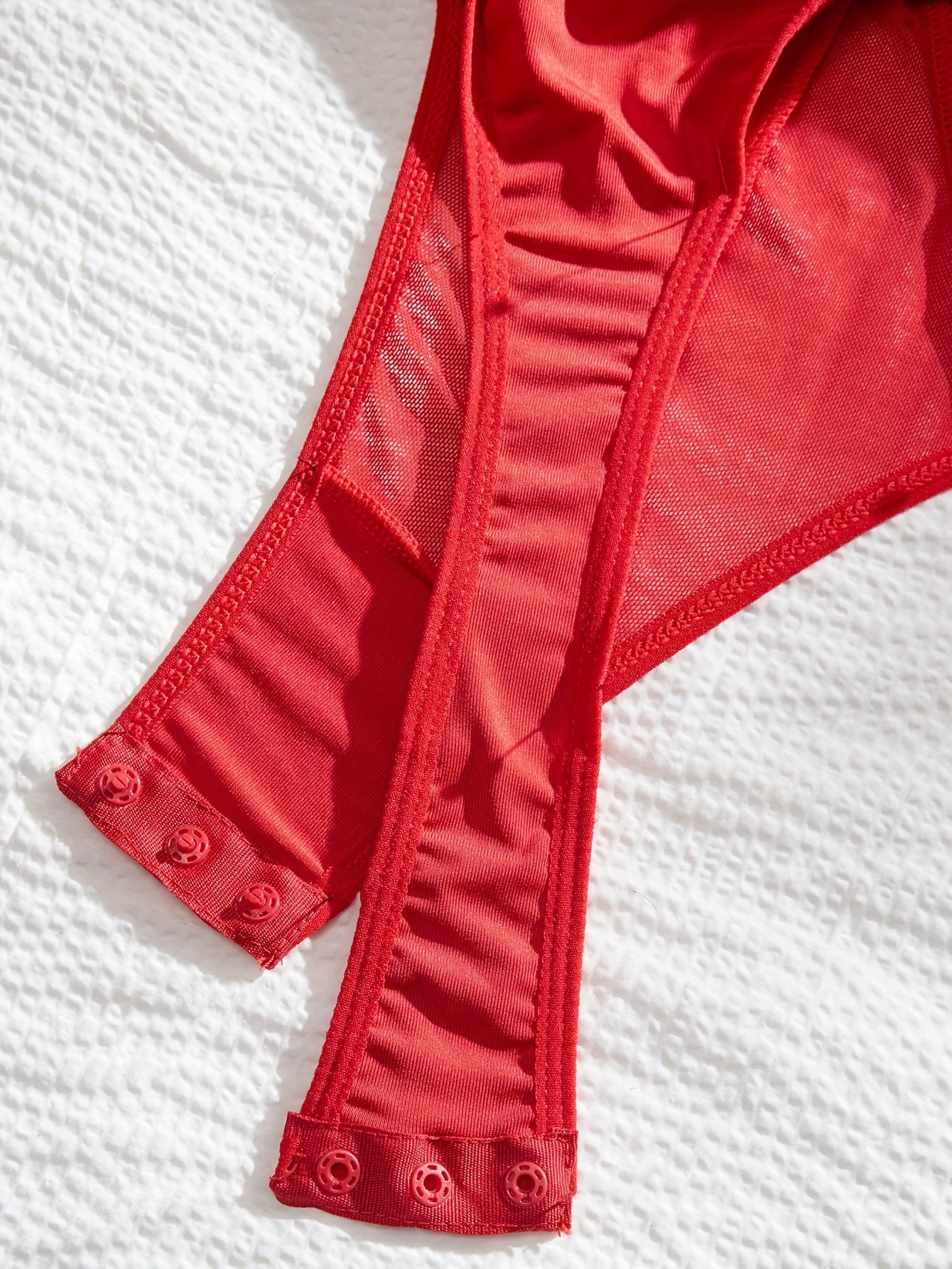 Body de encaje sexy europeo y americano con costura cruzada y correa colgante para el cuello