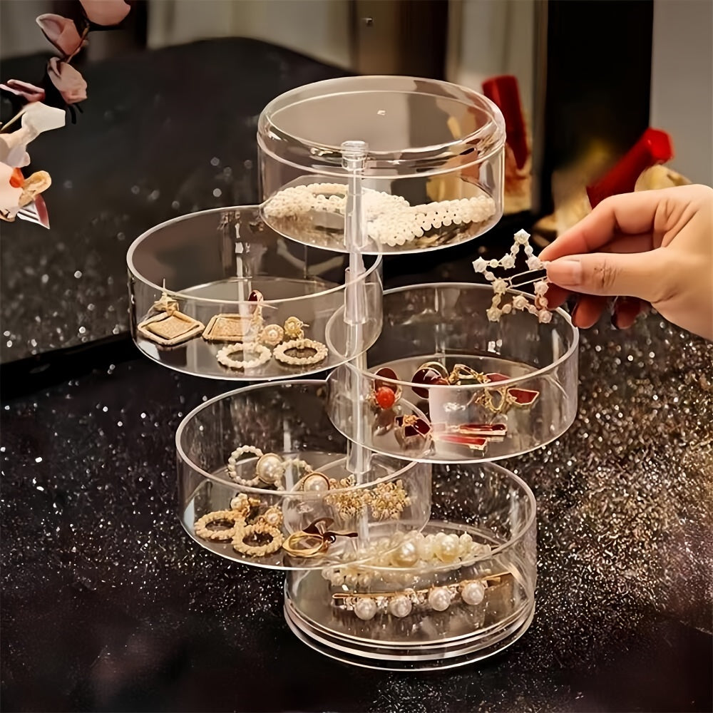 Aylanuvchi zargarlik va makiyaj saqlash qutisi, bilakuzuklar va sirg'alar uchun dumaloq plastik tashkilotchisi bilan. Buni uy, oshxona, hammom yoki yotoqxona uchun estetik xona bezaklari sifatida ko'rsatish stendi sifatida ishlatish mumkin.