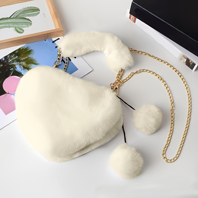 Yengil dizayndagi ajinli ayollar uchun plush yurak shaklidagi yelka sumkasi, ajratiladigan tasma va zip yopilishi bilan. Kundalik sayrlar, xaridlar va uchrashuvlar uchun mukammal. Yorqin pushti va boshqa ranglarda mavjud.