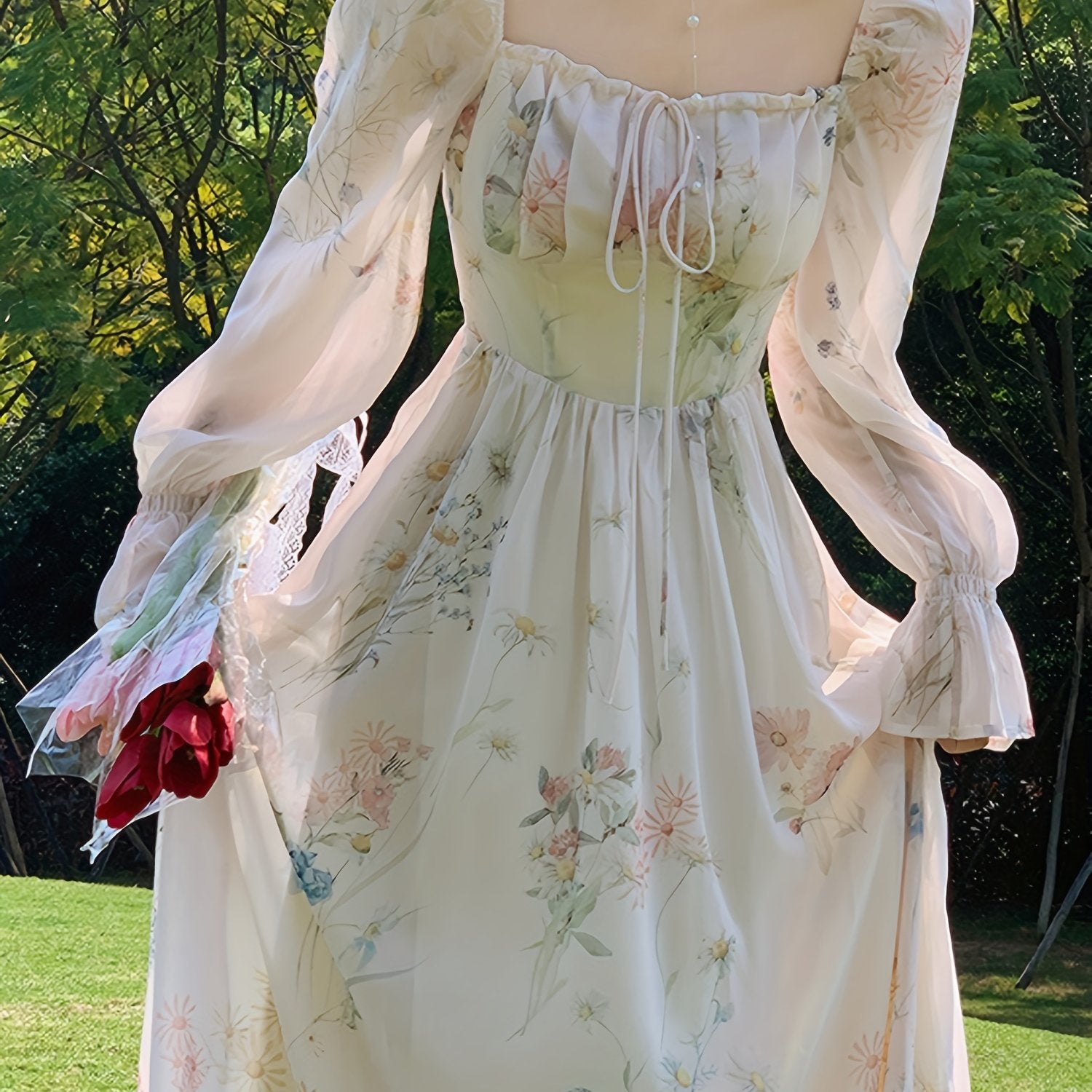 Gul naqshli chiffon materialidan tayyorlangan, qo'ltiq qismi keng midi ko'ylak - barcha fasllar uchun mukammal.