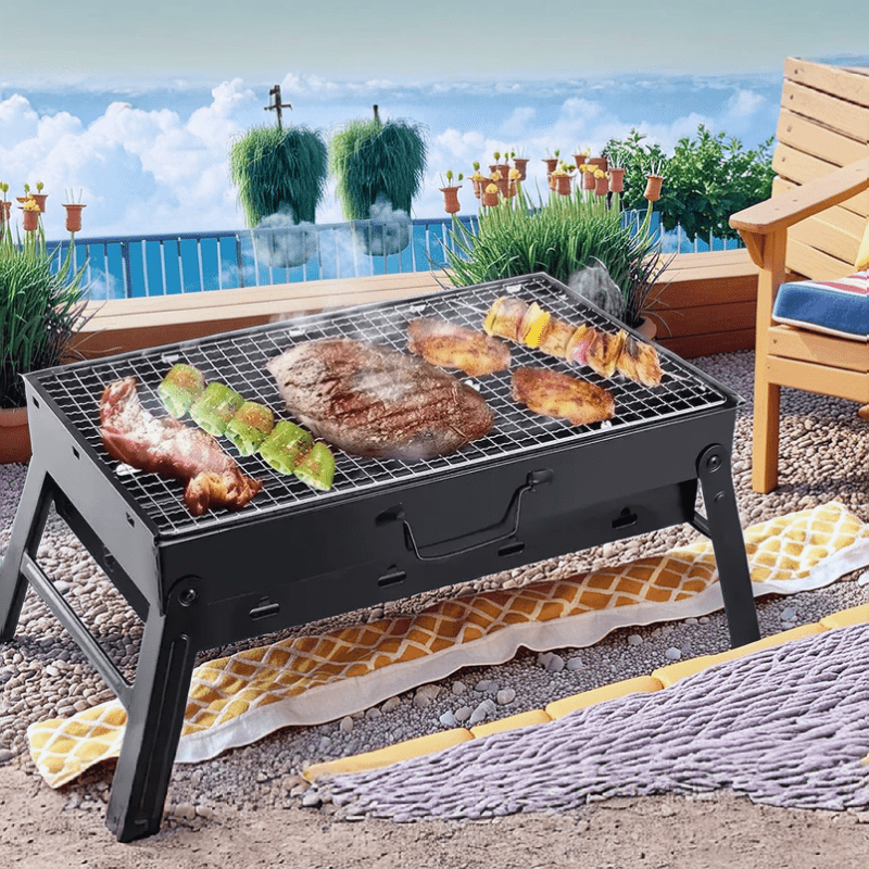 Parrilla portátil plegable de acero inoxidable, perfecta para acampar, hacer picnic y cocinar al aire libre. Diseño compacto y duradero.