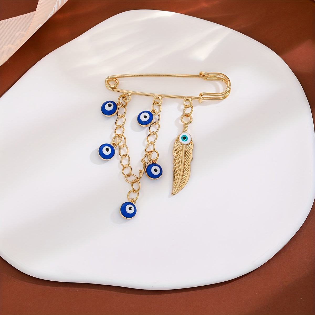 Set of 2 Vintage Crystal Evil Eye Brooches in Blue with Tassels and Cold Wind Detailing