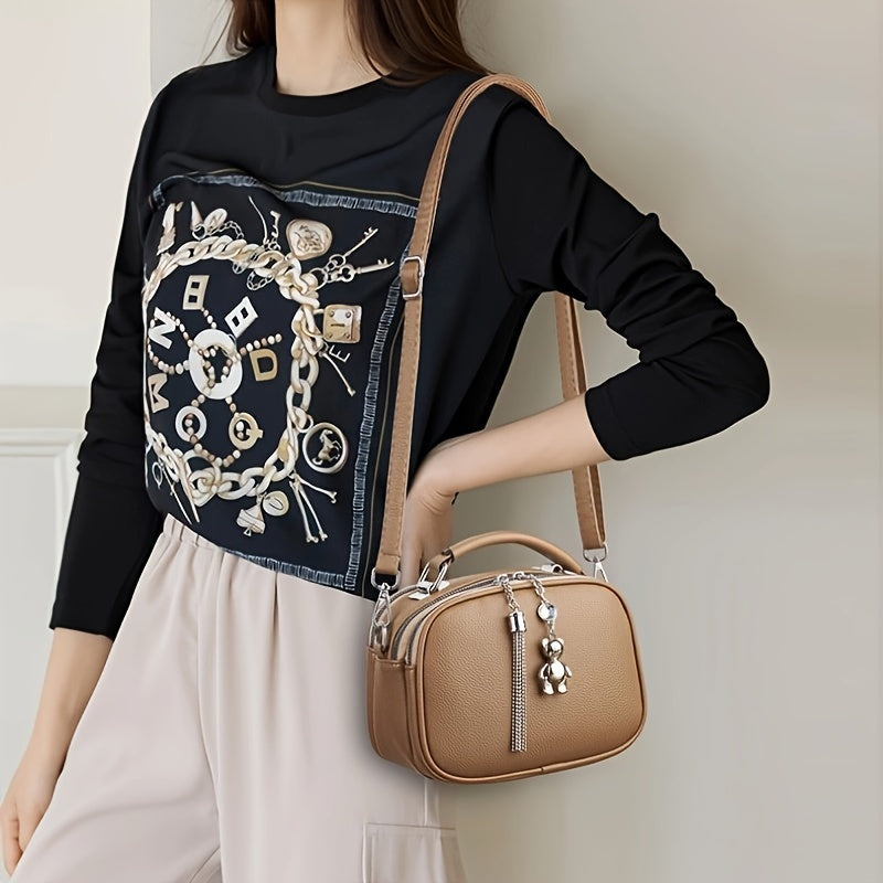 Black Mini Crossbody Bag with Bear Tassel and Multiple Compartments