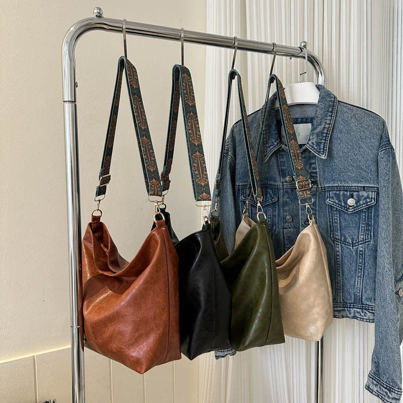 Yangi zamonaviy va nafis ayollar sumkasi, katta sig'imli, sozlanadigan yelka tasmalari, zip yopilishi, ajratiladigan tasmalari, naylon astari va khaki, yashil, jigarrang va qora ranglarda mavjud.