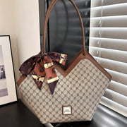 Ayollar uchun sharf bezakli va nafis dizaynga ega bo'lgan klassik nişli naqshli sumka.