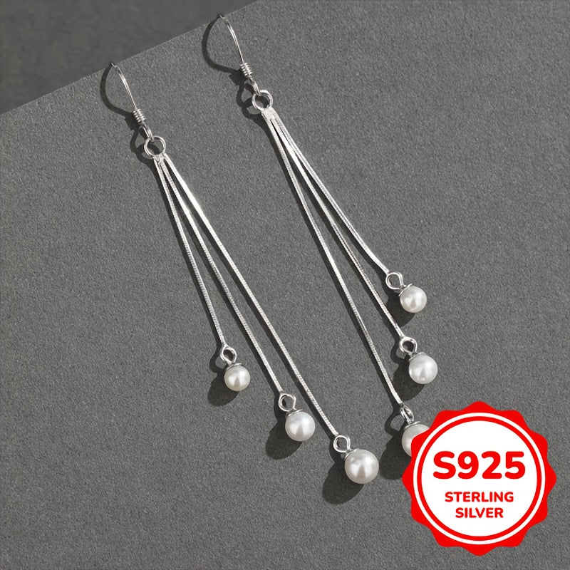 Silliq va zamonaviy, bu S925 Sterling Silver sirg'alar uzun tassellarga va shirin suv marvaridlariga ega. Gippoallergen va 2G og'irlikda yengil, ular ayollar uchun har kuni kiyish uchun ideal va ajoyib Onalar kuni sovg'asi bo'ladi.