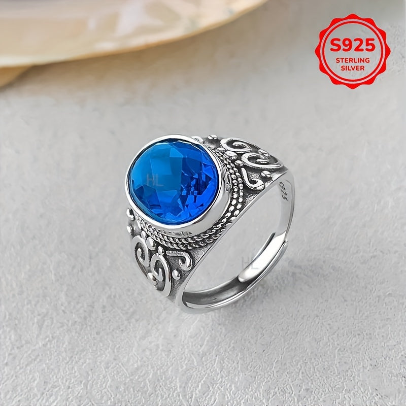 Vintage Style Sterling Silver Ring with Blue Zirconia and Carved Flower Design