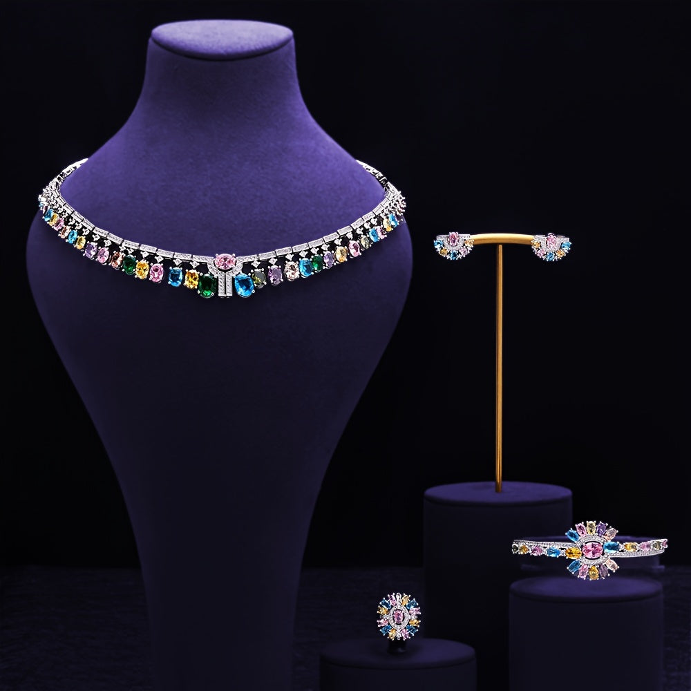 Zarif kelin zargarlik to'plami, kubik zirkoni bilan - to'ylar va maxsus tadbirlar uchun marjon, bilaguzuk, uzuk va sirg'alar o'z ichiga oladi.