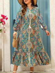 Katta o'lchamdagi gullar bilan bezatilgan maksi ko'ylak, V-shaklidagi bo'yin, qirrali pastki qismi va lantern qo'lqonlari bilan. 100% polyesterdan tayyorlangan, mashinada yuvish mumkin. Bahor/kovak uchun mukammal.