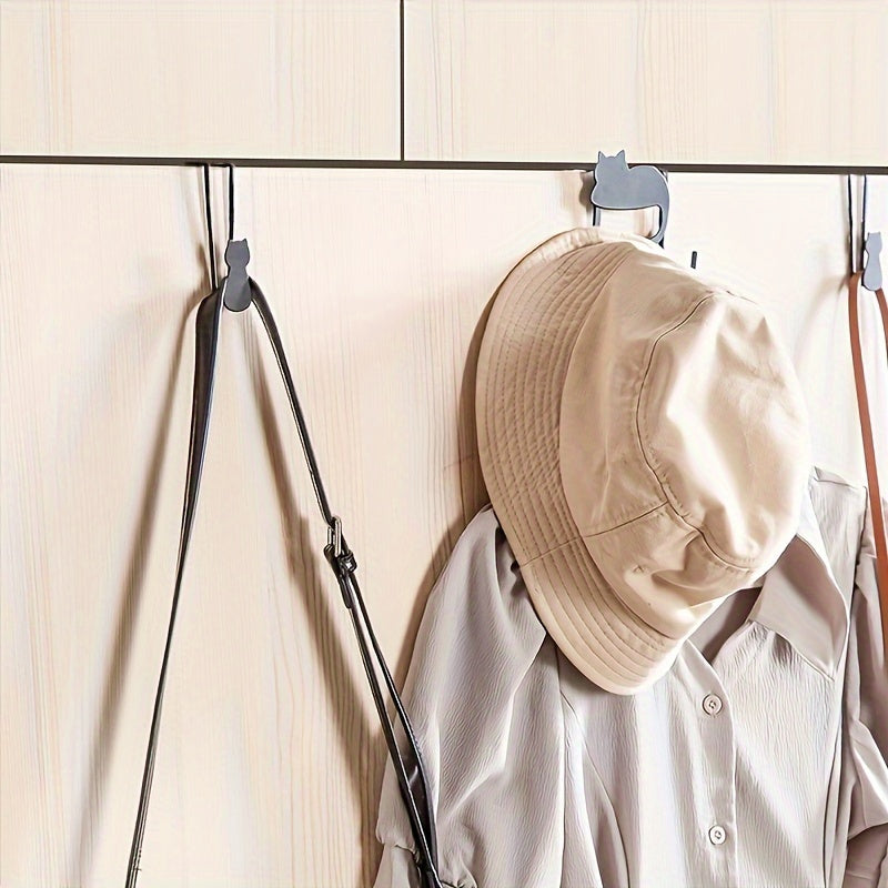 Kattalar uchun metall devor tutqichlari, shuningdek, kiyimlar, shapka, sochiqlar, kalitlar va uy bezaklari uchun mo'ljallangan