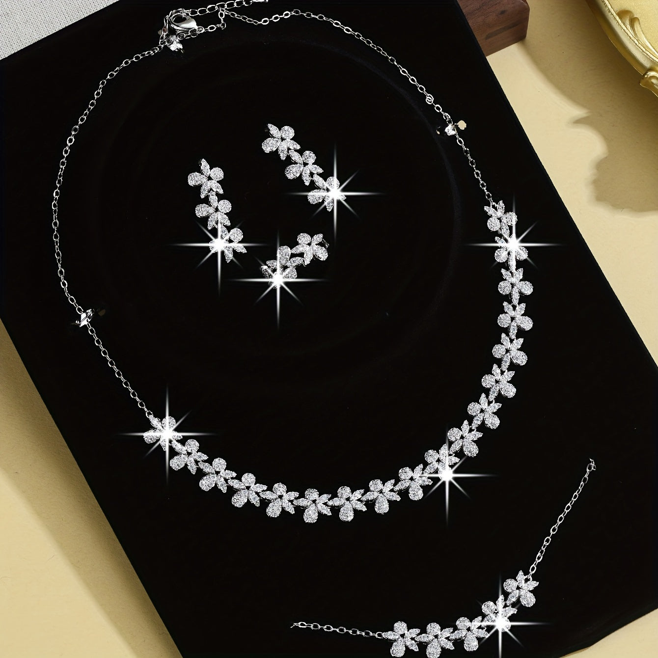 Luxurious Bridal Jewelry Set with Synthetic Zirconia, featuring a Stunning Flower Petal Design in 18K Gold Plating - Includes Necklace, Bracelet, Earrings, and Ring perfect for Wedding and Party Events. Made with Copper Base for utmost quality and