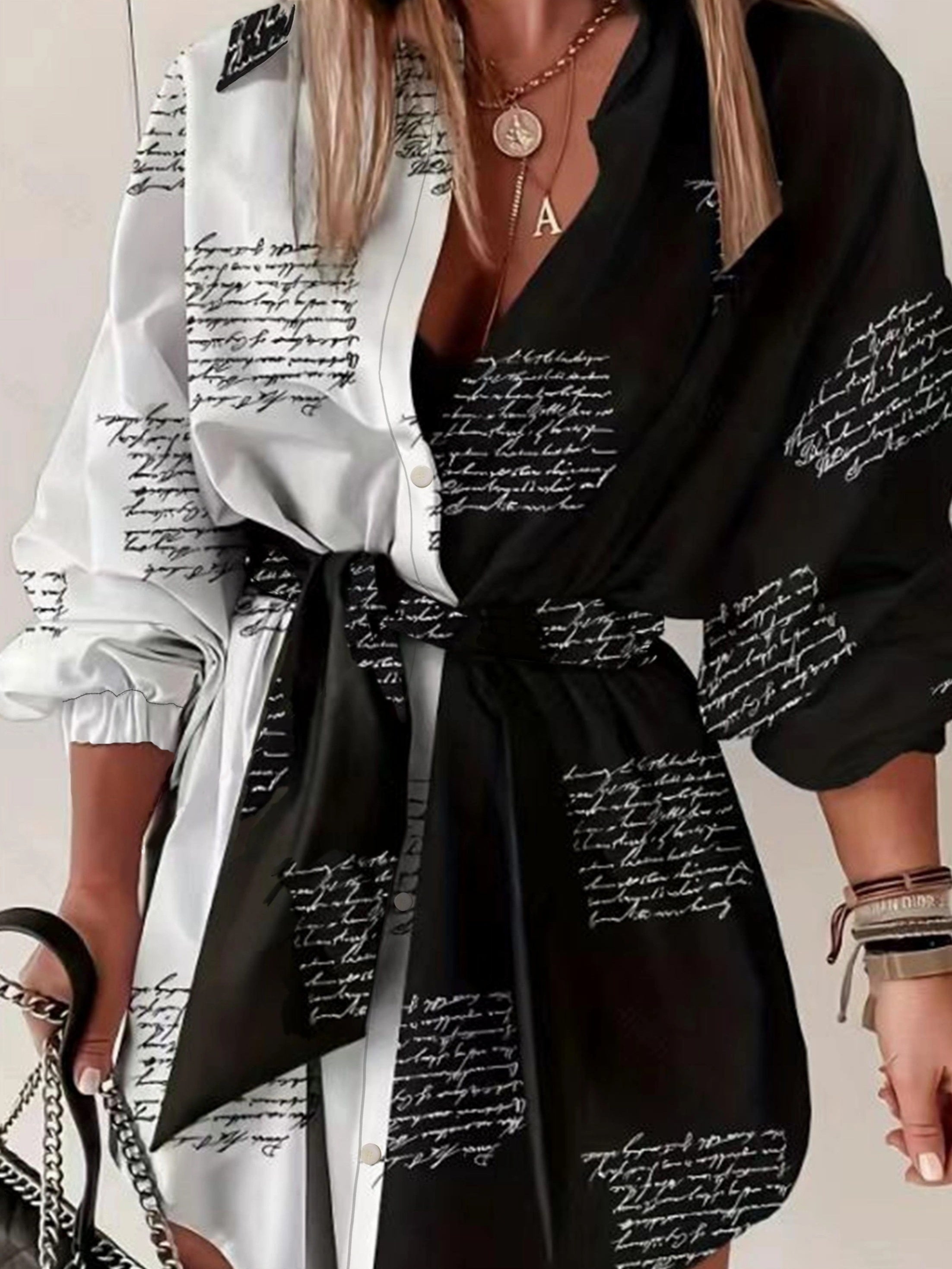 Ayollar uchun belbog'li plussayz rangli blokli ko'ylak. V-yuqori, uzun yeng, harf bosma. Mashinada yuvish mumkin, polyesterdan tayyorlangan. Norasmiy uslub.