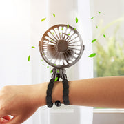 Ventilador mini portátil con soporte ajustable y correa para la muñeca, recargable por USB, ligero y compacto para cochecitos, actividades al aire libre y viajes