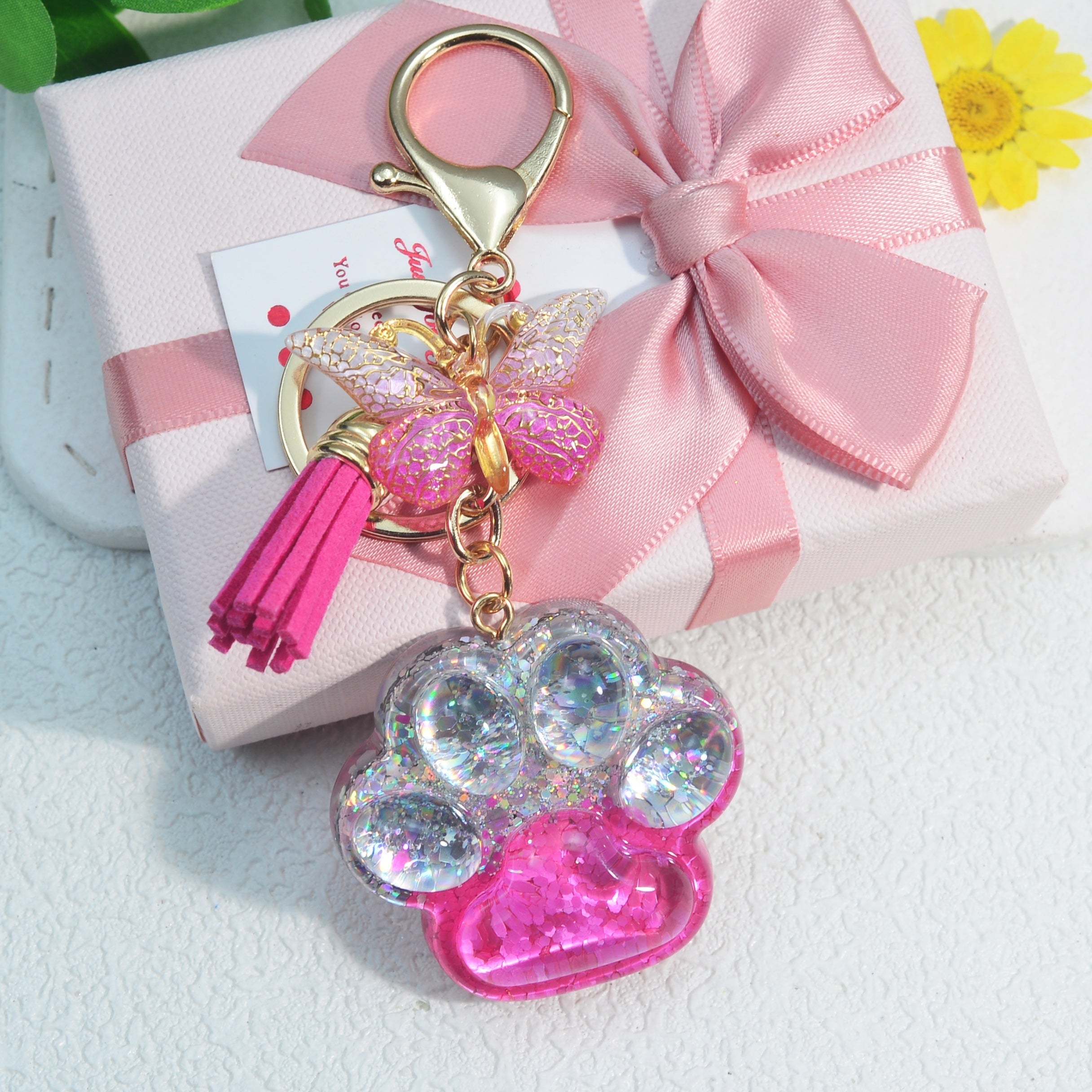 Llavero con borla de mariposa y pata de gato para amantes de los animales