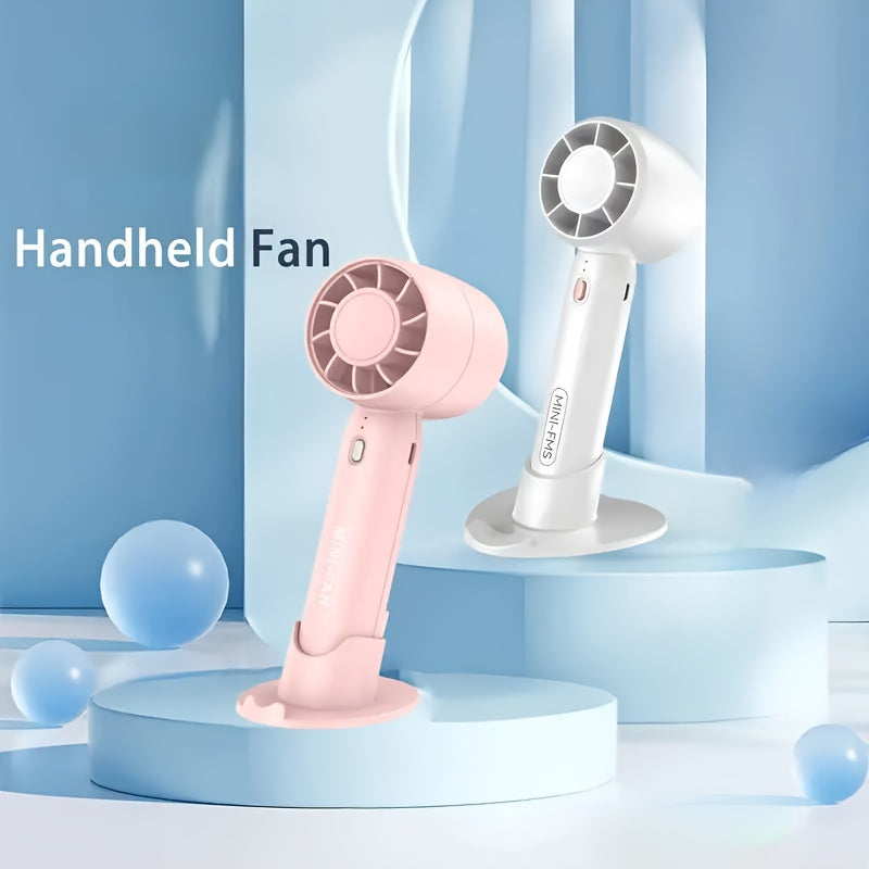 Portativ mini fan, USB bilan qayta zaryadlanadigan, 3 tezlik sozlamasi va asos standi bilan. Uy, ofis va ochiq sayohatlar uchun mos. Uchta rangda mavjud.