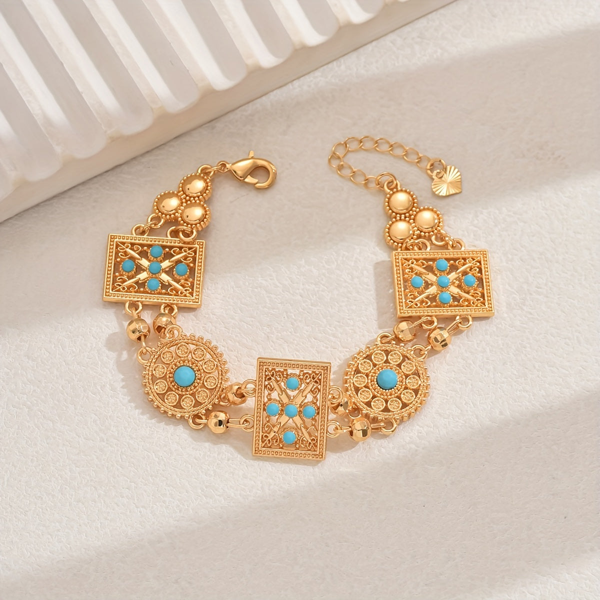 Women’s Gold Plated Alloy Bracelet with Geometric Cut-Out and Blue Cubic Zirconia