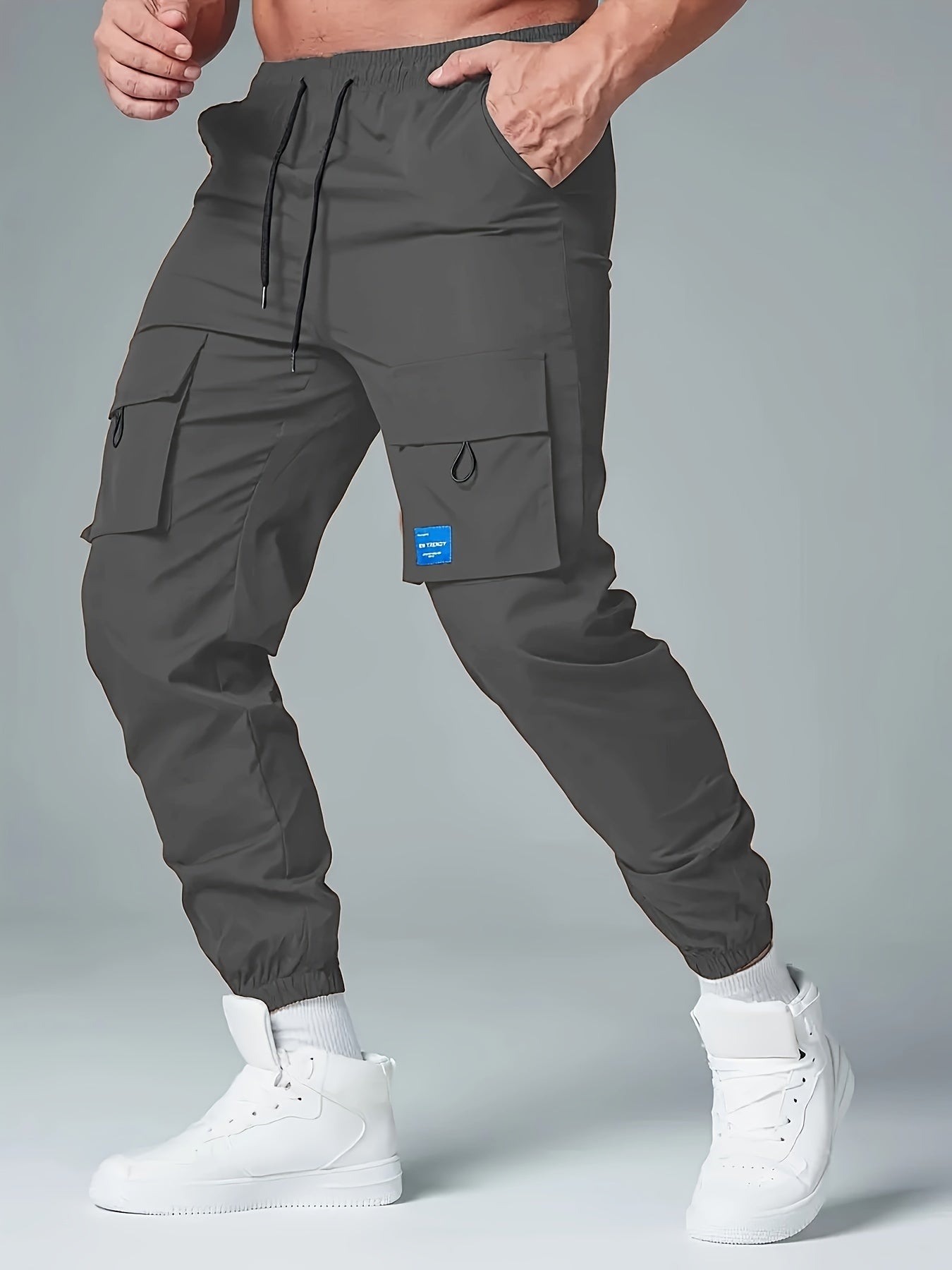 Men's Polyester Cargo Pants with Drawstring Waist and Multiple Pockets for Spring and Fall