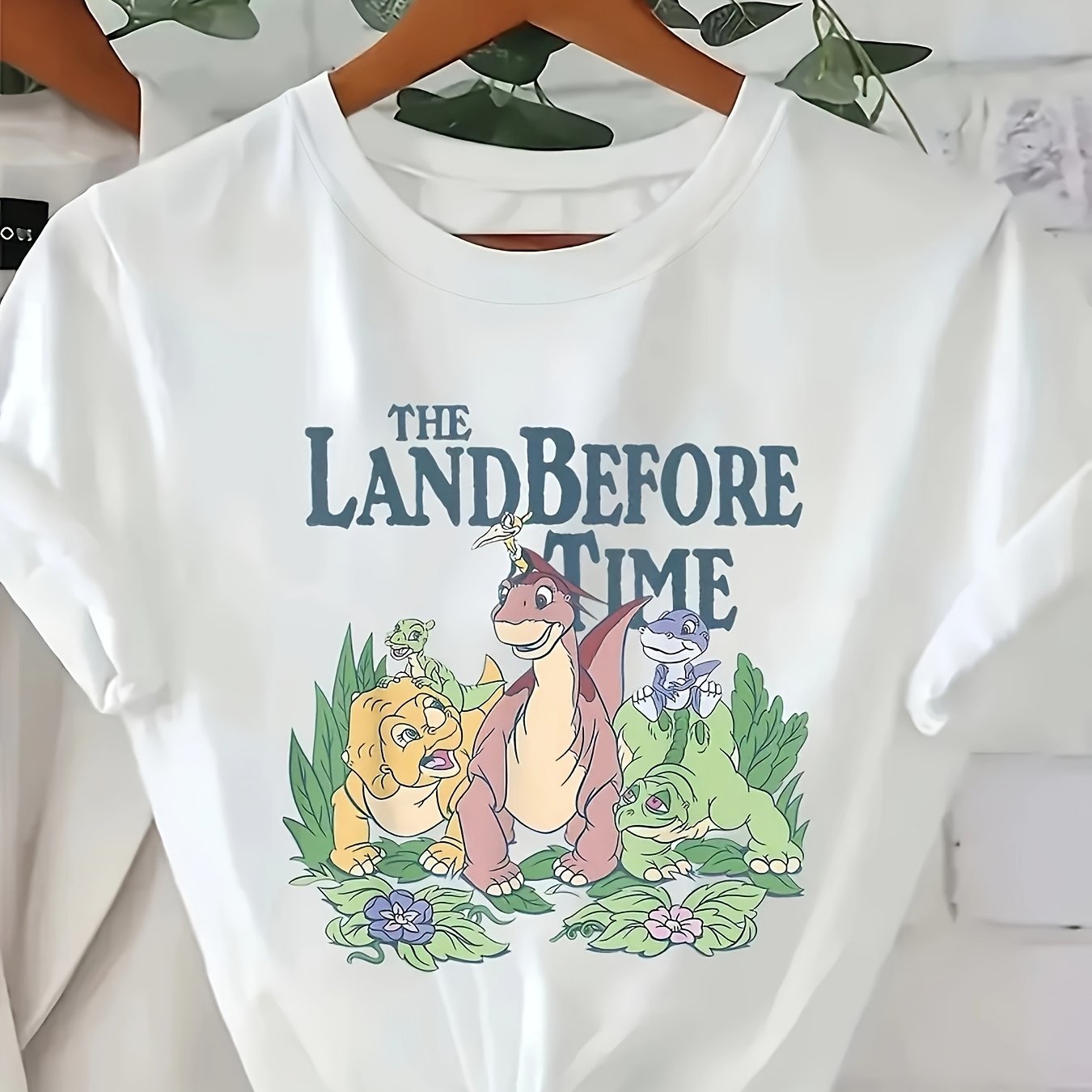 Plus Size Women's Pink Dinosaur Graphic T-Shirt with Floral Print