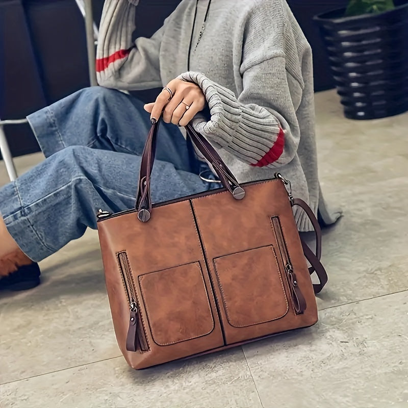 Ayollar uchun kulrang va och jigarrang rangdagi keng vintage uslubidagi xochli sumka, retro dizayni, zipper yopilishi, chetni moylash tugatishi bilan, kundalik foydalanish uchun ideal.