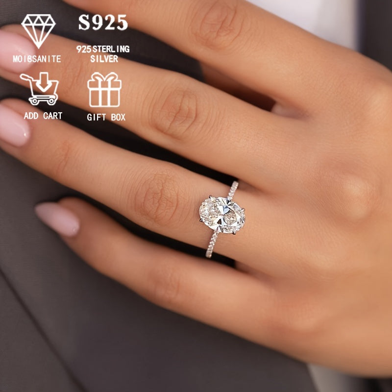 Серебряное обручальное кольцо с овальным моиссанитом, выполненное в элегантной 4-лапковой паве. Вечный модный аксессуар для женщин, идеальный для предложений, юбилеев, дней рождения и Дня матери. Поставляется в красивой подарочной коробке.