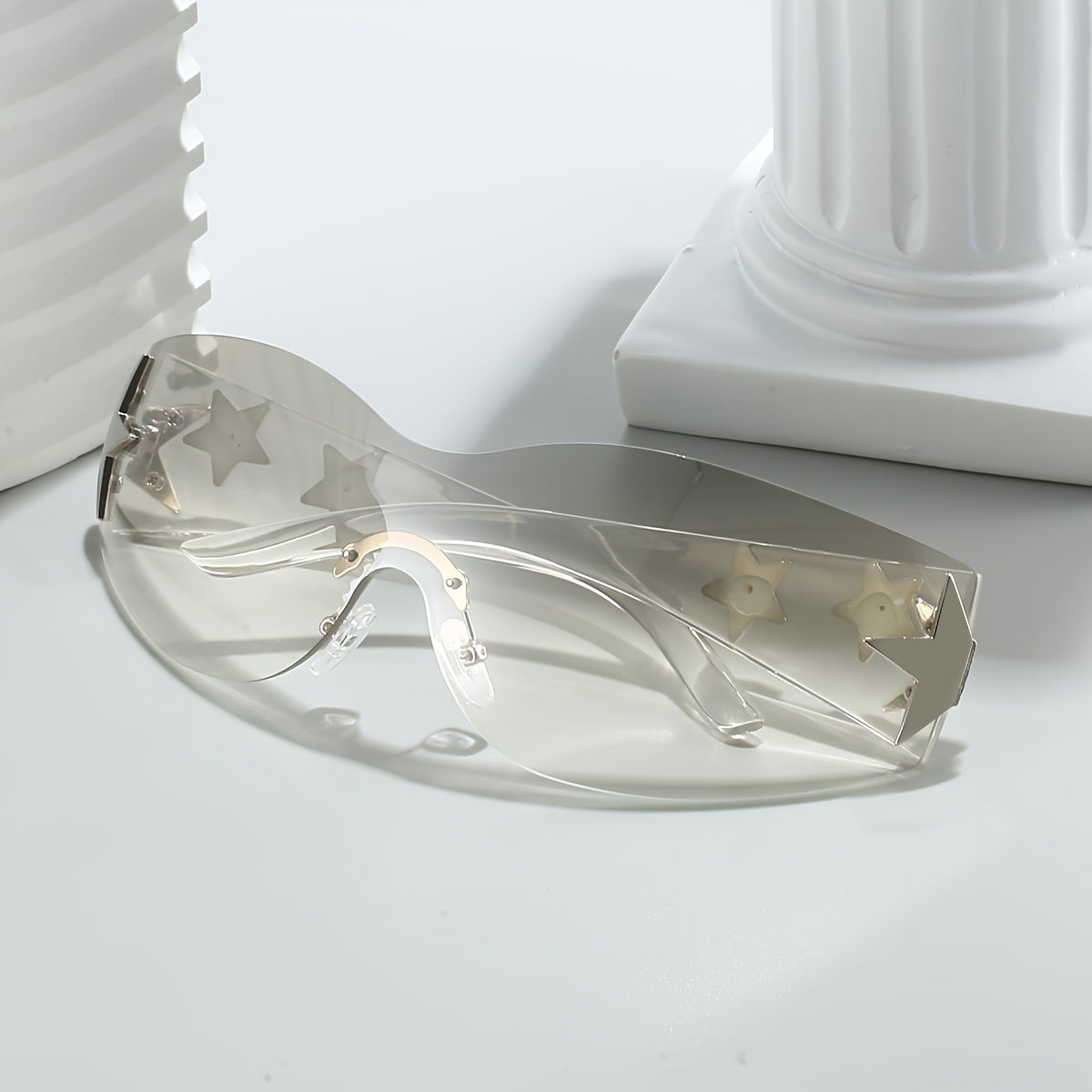 Gafas de moda unisex de gran tamaño con diseño futurista sin marco y decoraciones de estrellas