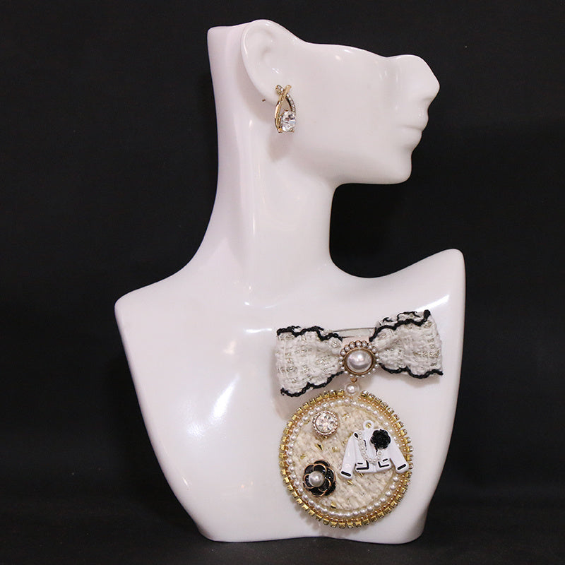 Broche de lazo negro con perlas falsas para la moda femenina