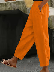 Pantalones casual de talla grande para mujer con cintura elástica y bolsillos, color sólido, pierna ancha