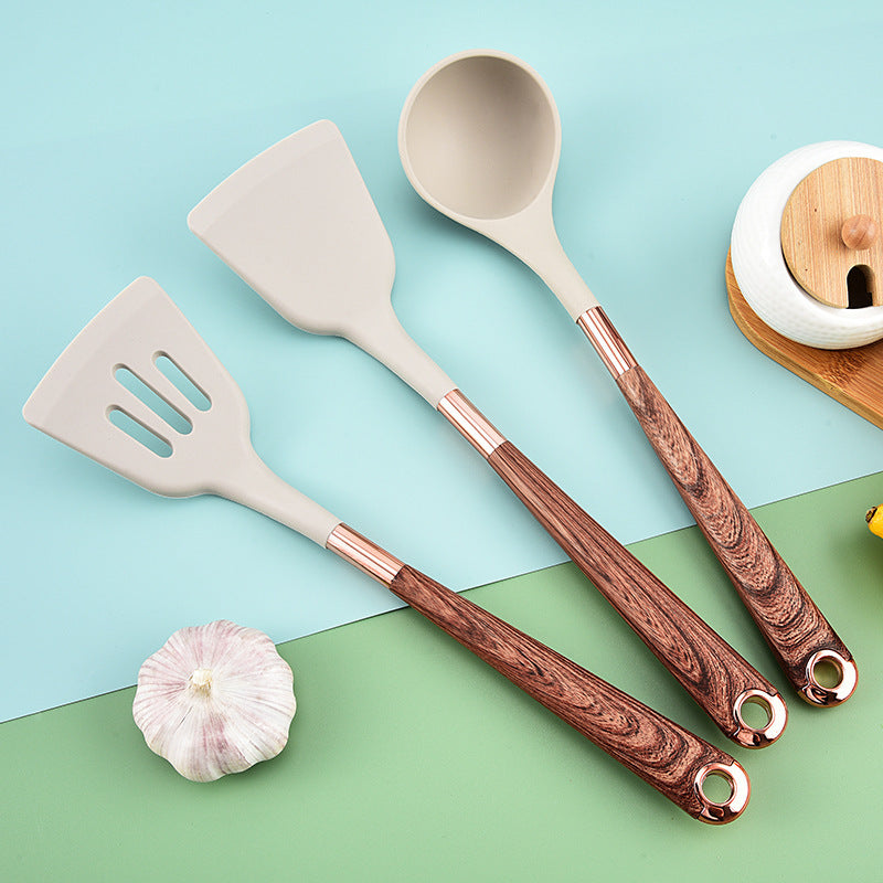Silicone yog'och to'qimalari spatula, yopishmaydigan qoplama va issiqqa chidamli tutqich bilan, uyda pishirish uchun zarur bo'lgan oshxona asbobi