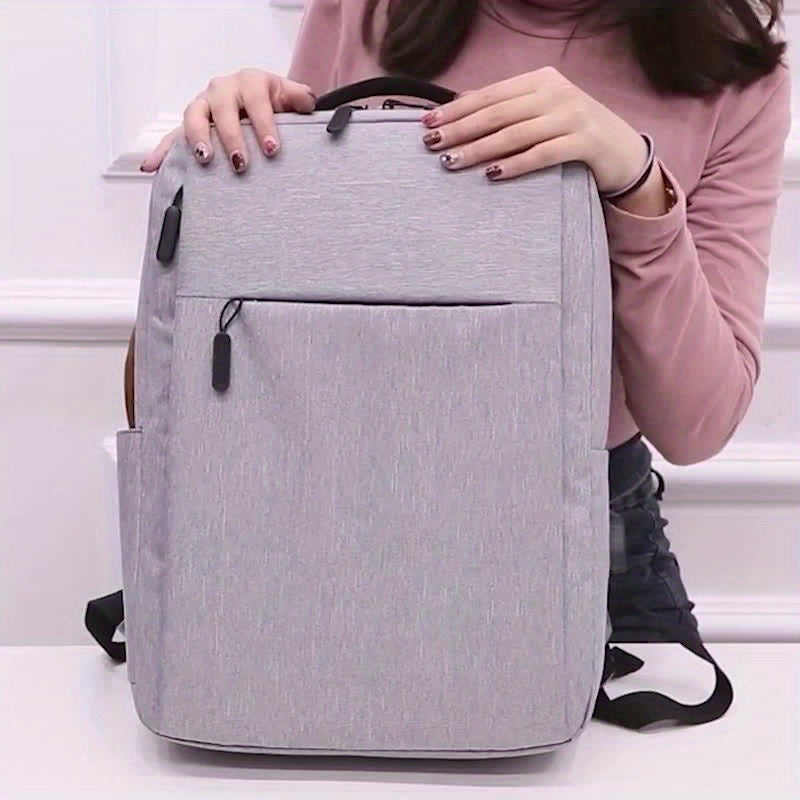 Grey Fabric Laptop Backpack with Zipper Closure and Adjustable Strap for School and Outdoor Use