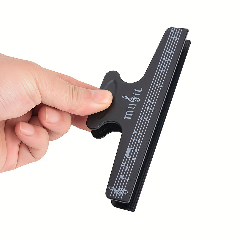 "Partitura klipi, Musiqa notatsiyasi klipi, Kitob klipi, Besh qatorli notatsiya klipi, Qattiq musiqa notatsiyasi klipi, Ofis papkasi klipi, Musiqiy nota qog'oz kliplari, Piano musiqa notatsiyasi klipi, Baraban"