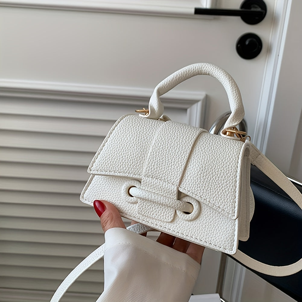 Zamonaviy niş dizayni, yuqori tutqichi va kvadrat shakli bilan uslubiy mini crossbody sumka.