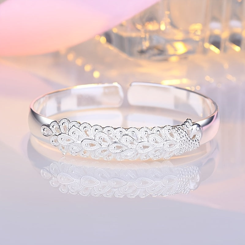 Women’s Ethnic-Inspired Bracelet with Peacock Feather Silk Opening and Phoenix Design