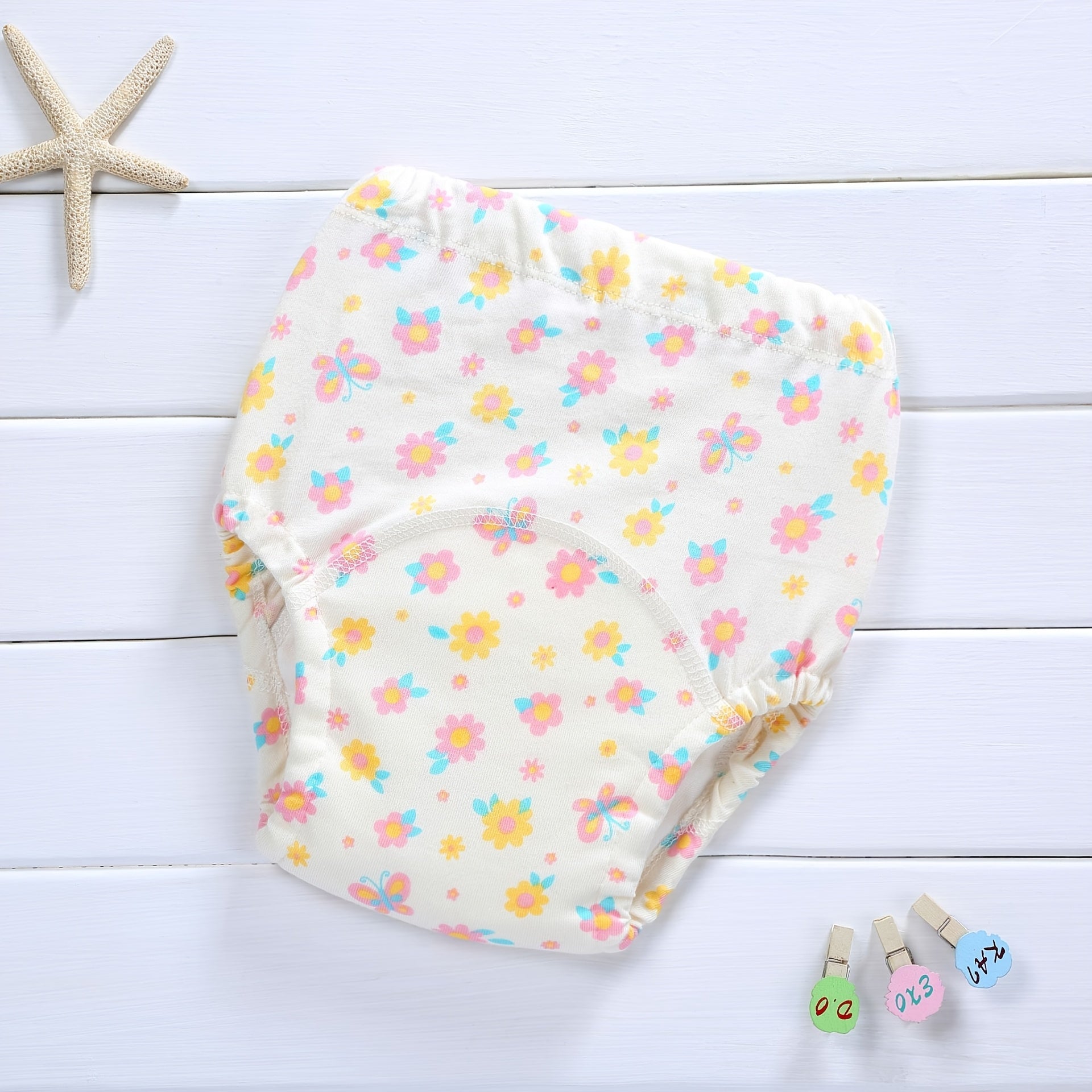 Yoshlar uchun suv o'tkazmaydigan va yuvilishi mumkin bo'lgan trening shimlari, koreys uslubidagi 4-qavatli gazlama dizayni bilan, qiziqarli multfilm dizaynlari bilan.