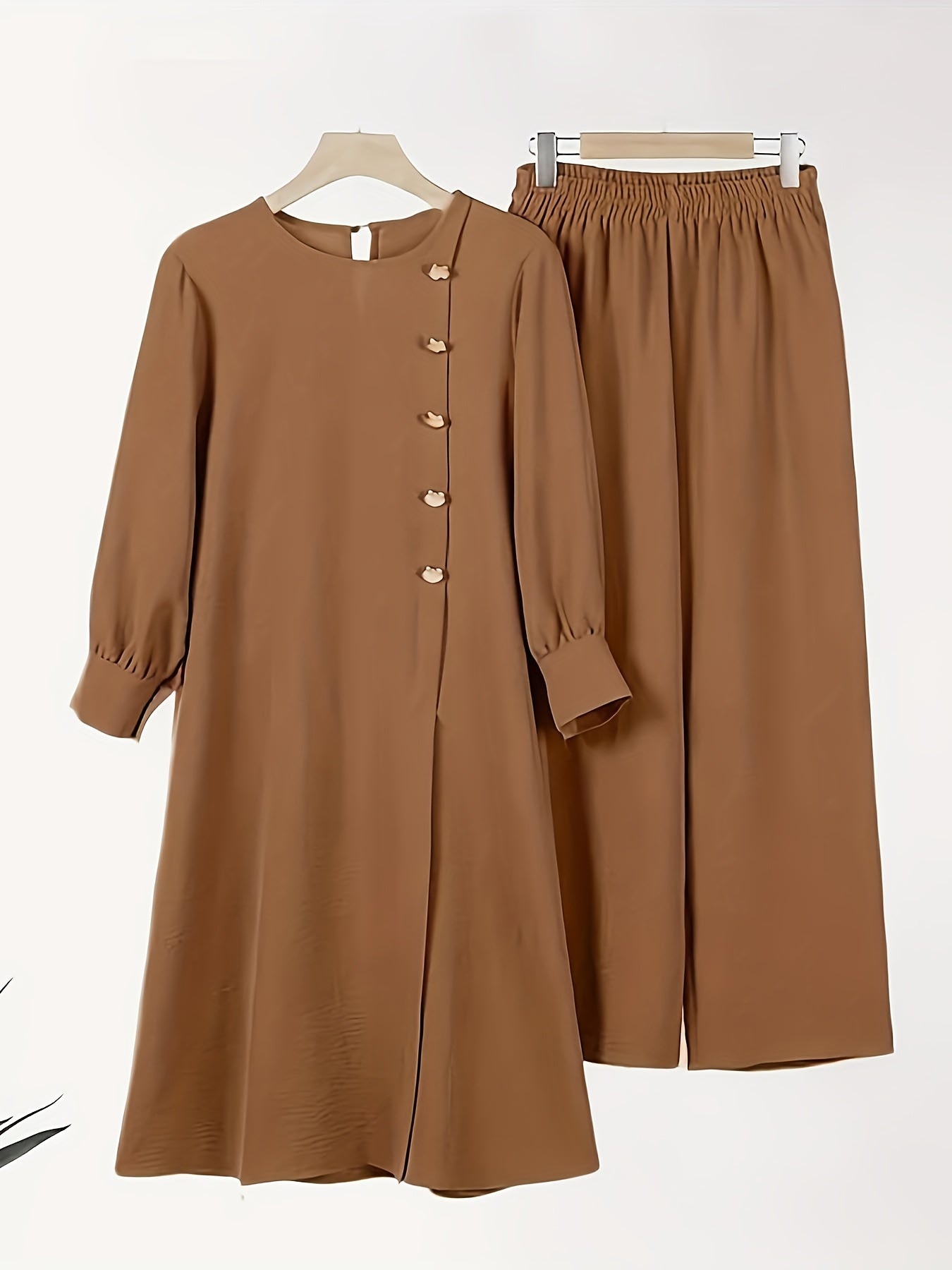 Conjunto de dos piezas de poliéster negro con mangas de farol y pantalones de pierna ancha para mujer