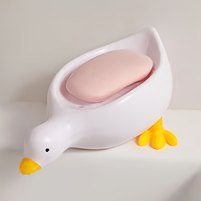 Jabonera con forma de pato con drenaje automático y diseño de cascada para una limpieza fácil