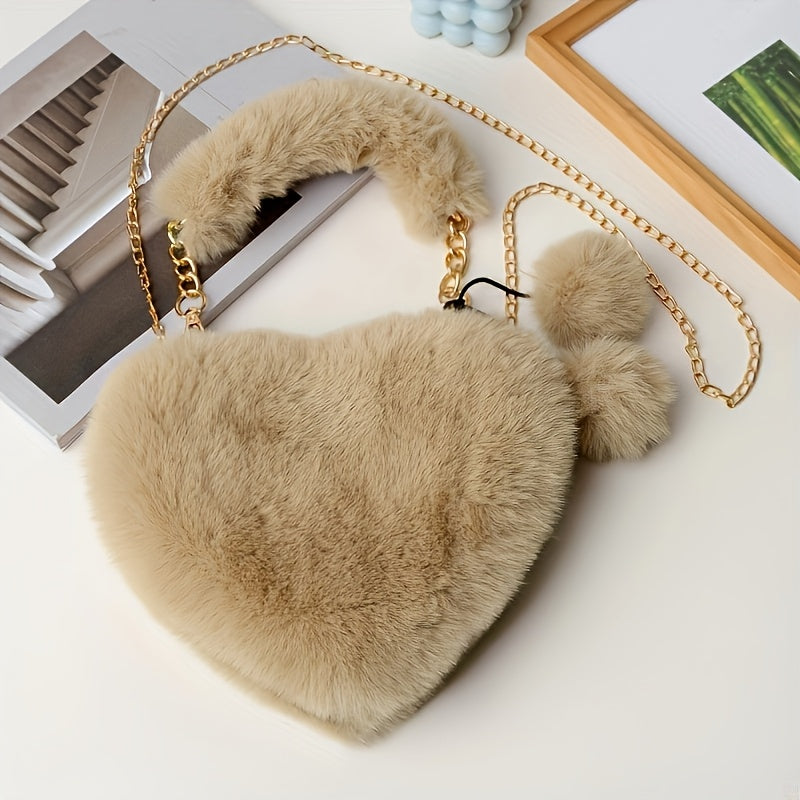 Yengil dizayndagi ajinli ayollar uchun plush yurak shaklidagi yelka sumkasi, ajratiladigan tasma va zip yopilishi bilan. Kundalik sayrlar, xaridlar va uchrashuvlar uchun mukammal. Yorqin pushti va boshqa ranglarda mavjud.