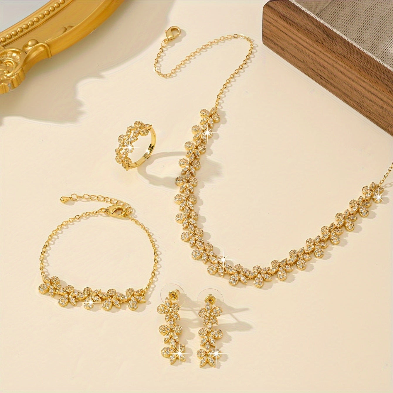 Luxurious Bridal Jewelry Set with Synthetic Zirconia, featuring a Stunning Flower Petal Design in 18K Gold Plating - Includes Necklace, Bracelet, Earrings, and Ring perfect for Wedding and Party Events. Made with Copper Base for utmost quality and