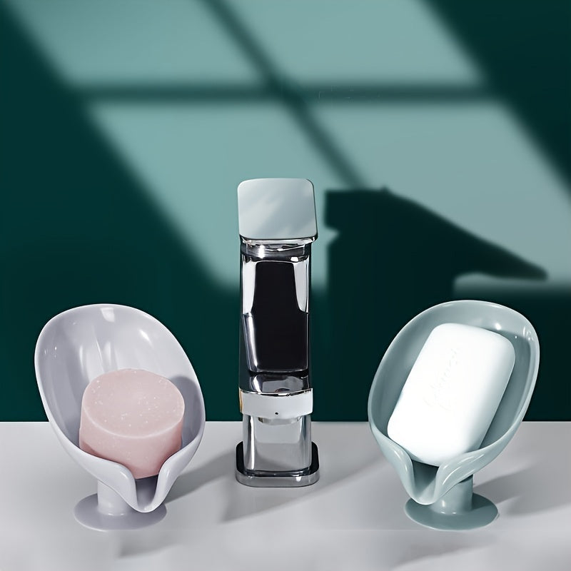 Yashil/xira rangda, kuchli so'rish va drenajga ega, elektr energiyasini talab qilmaydigan, hammom dekorini yaxshilaydigan, sabunni quruq saqlaydigan yaproq shaklidagi sabun idishi.