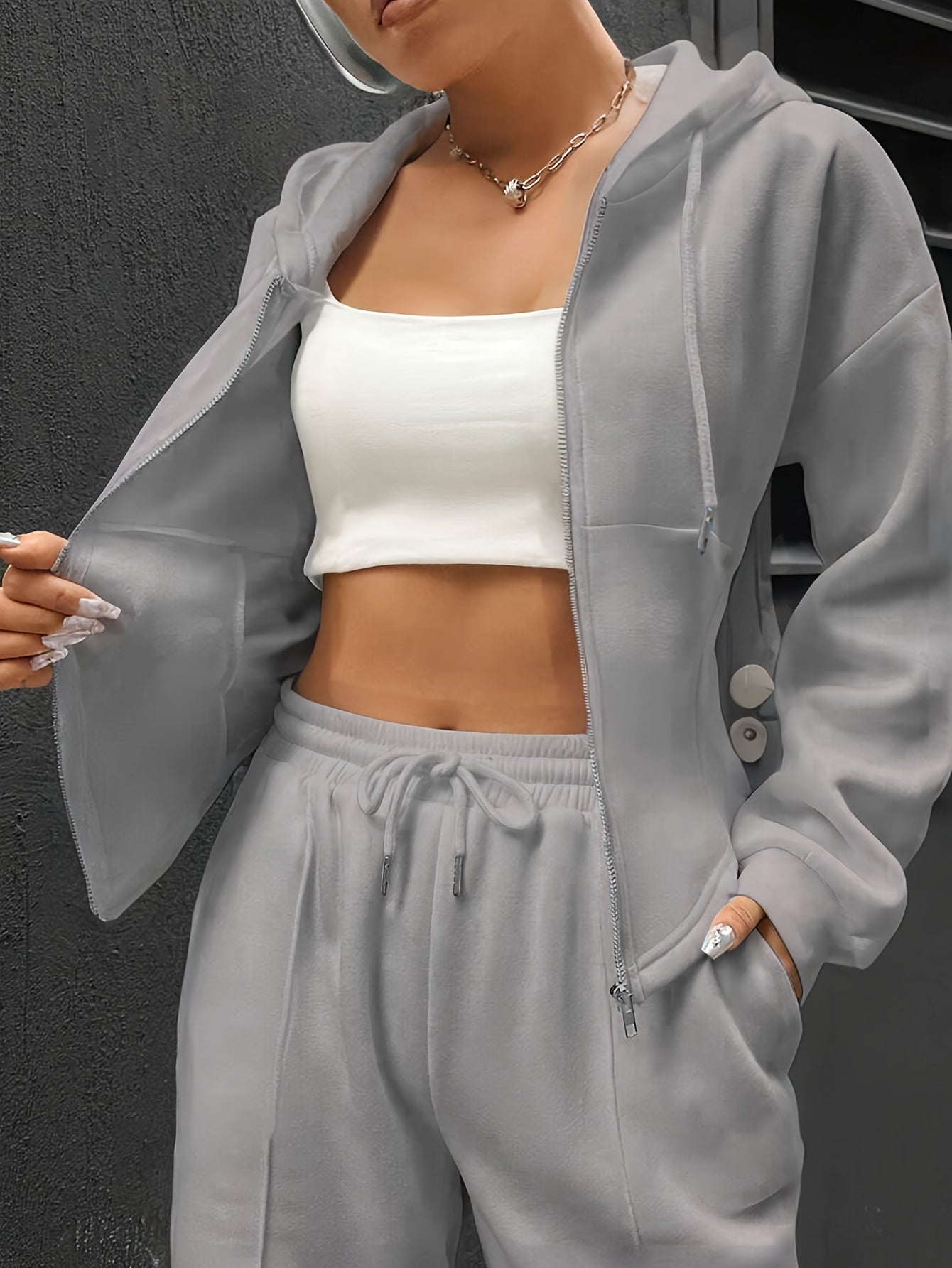 Conjunto elegante de chándal con capucha para mujer en tela de punto de poliéster sólido para primavera y otoño