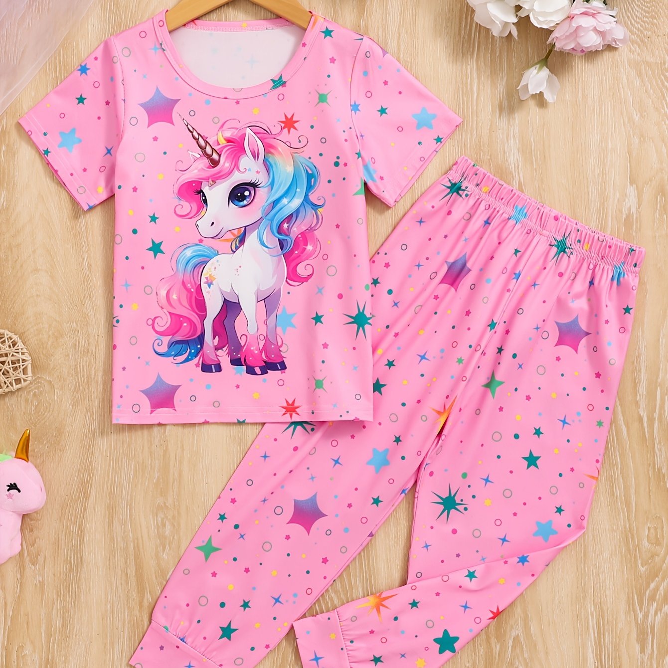 Qizlar uchun pushti unicorn va yulduz naqshli pijama to'plami, olovga chidamli, qulay qisqa yengli ko'ylak va uzun shimlar, bahor/kovak sovg'asi uchun ideal, mashinada yuvish mumkin.