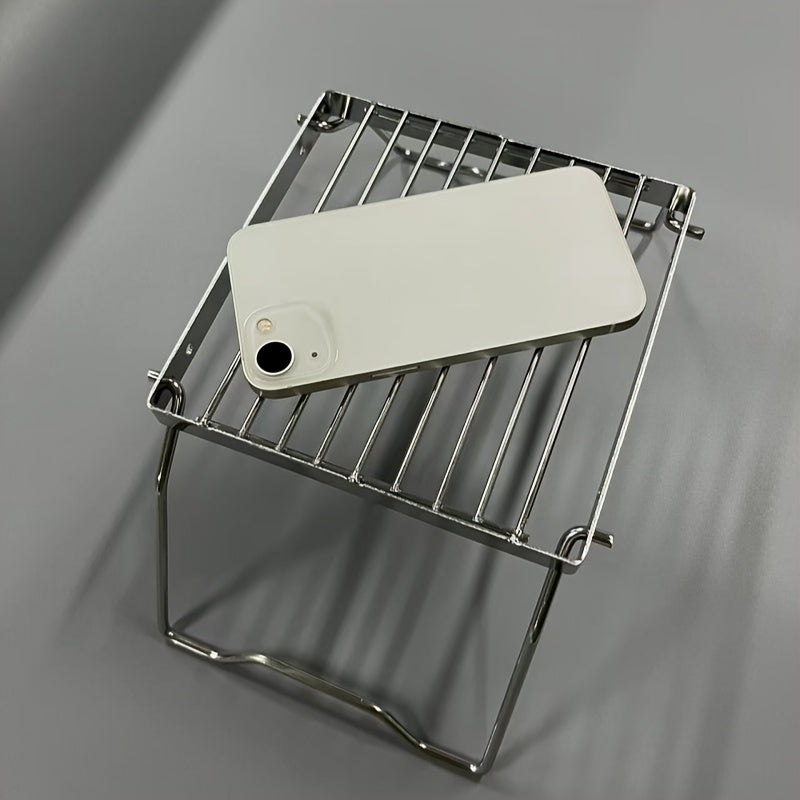 Tashqarida pishirish va BBQ uchun barqarorlashtiruvchi oyoqlarga ega kompakt zanglamaydigan po'latdan yasalgan sayohat grill.